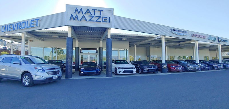 Outside view of dealership facade with row of cars | Matt Mazzei Chevrolet of Lakeport, CA
