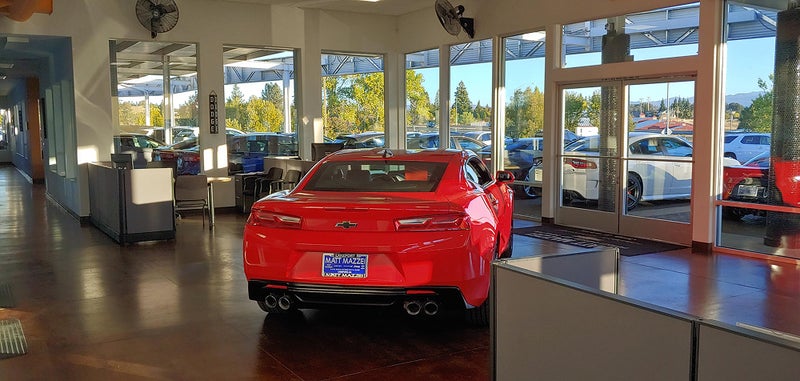 Interior view of Matt Mazzei Chevrolet showcasing a red Chevrolet Camaro | Matt Mazzei Chevrolet of Lakeport, CA